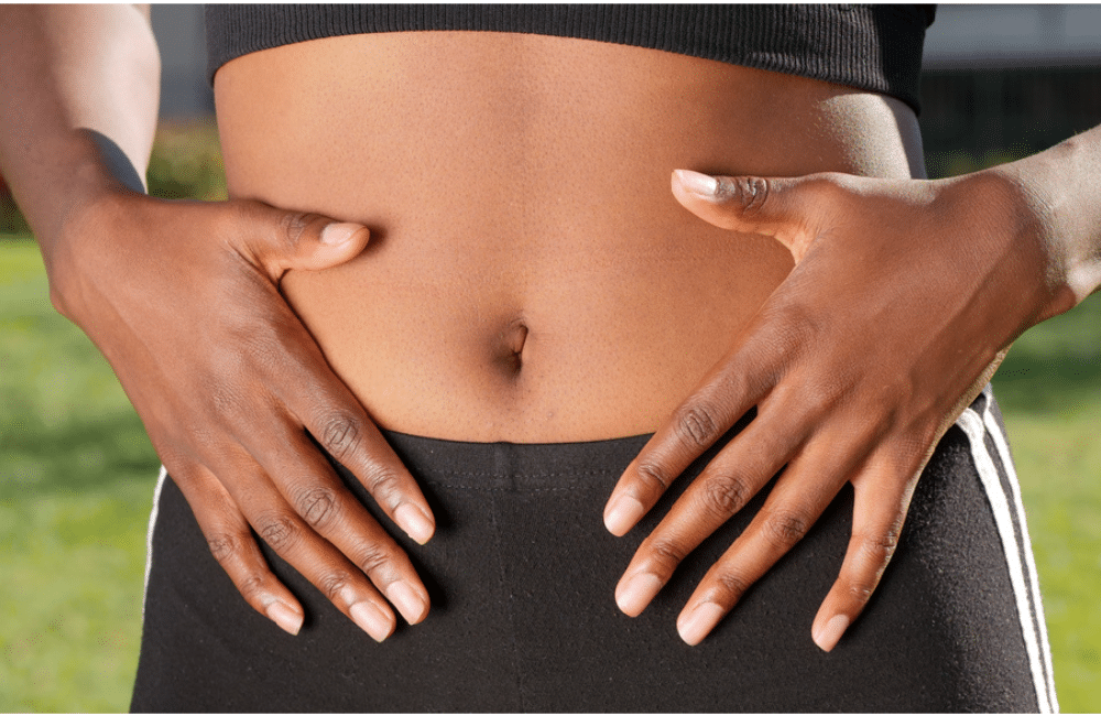 A person touching her belly